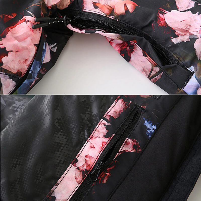 Close-up of floral-print waterproof jacket detailing with zippers, perfect for skiing and snowboarding in winter.
